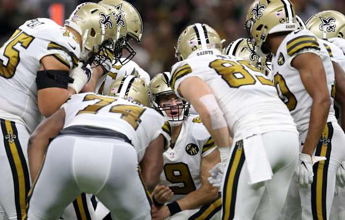 New Orleans, LA, USA; New Orleans Saints quarterback Drew Brees (9) calls a play in the huddle in the second quarter against the Philadelphia Eagles at the Mercedes-Benz Superdome. Mandatory Credit: Chuck Cook-USA TODAY
